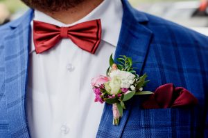 close up of groom's bow tie and pin hole